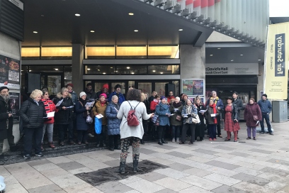 Choir performance outside St David's Hall on first Fair Saturday
