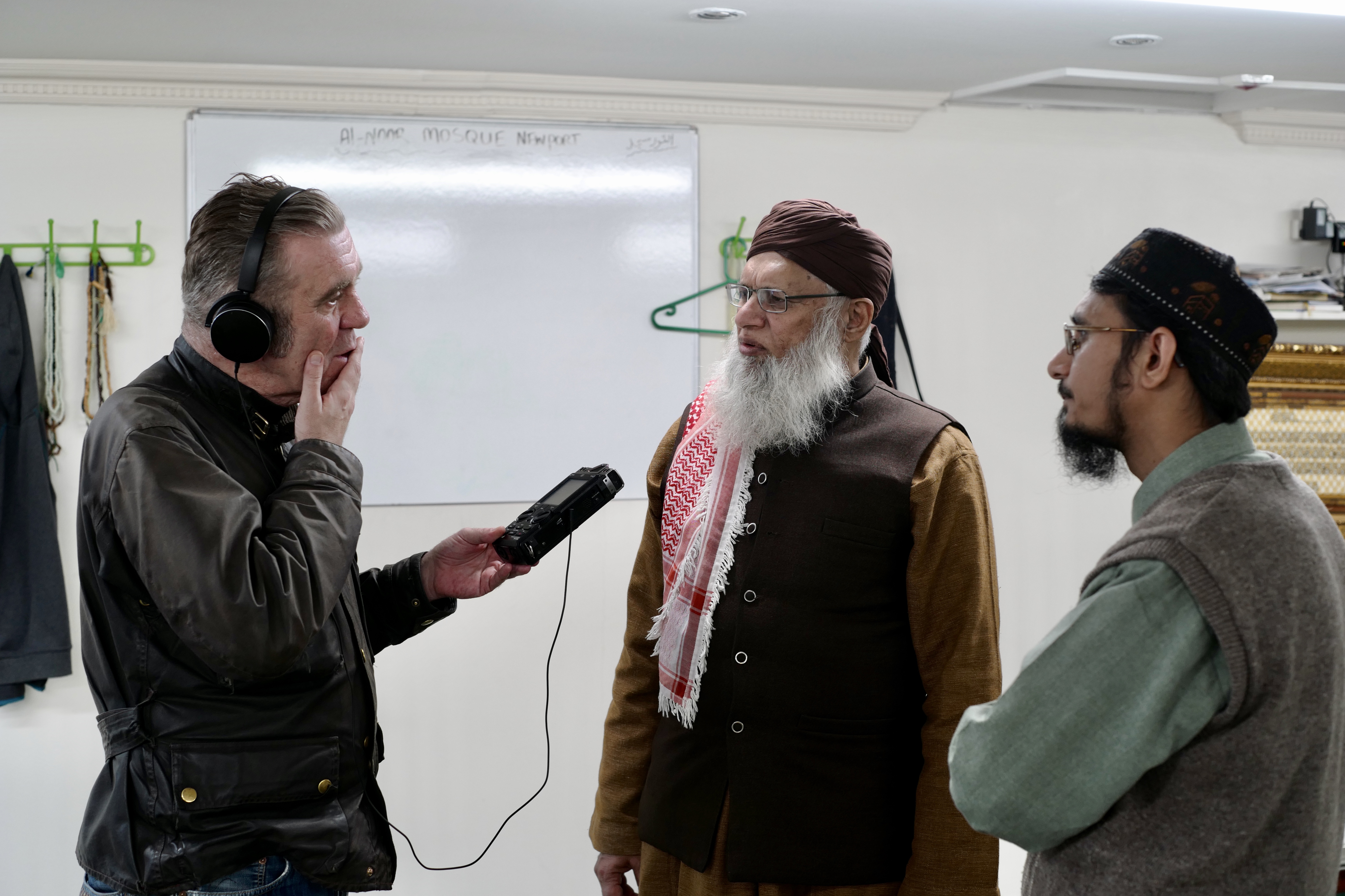'PARADE': A site-specific installation project based in Maindee, Newport. John interviewing Imams Muhammad Abid Chishti and Hafiz Mushtaq Ahmad in the Al-Noor Mosque.